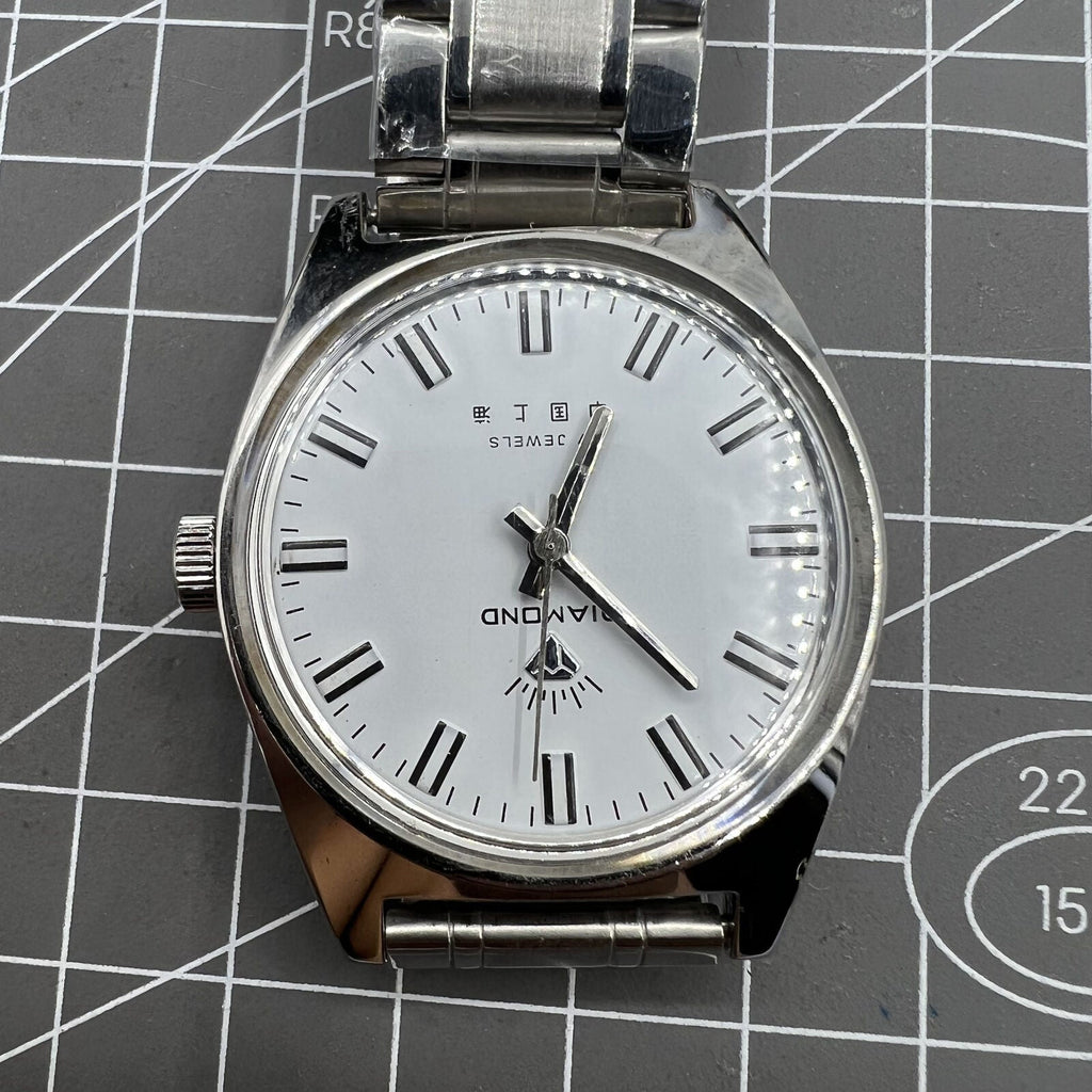 Shanghai Diamond 38mm manual mechanical watch with 17 jewels, white dial, silver case, elegant design.