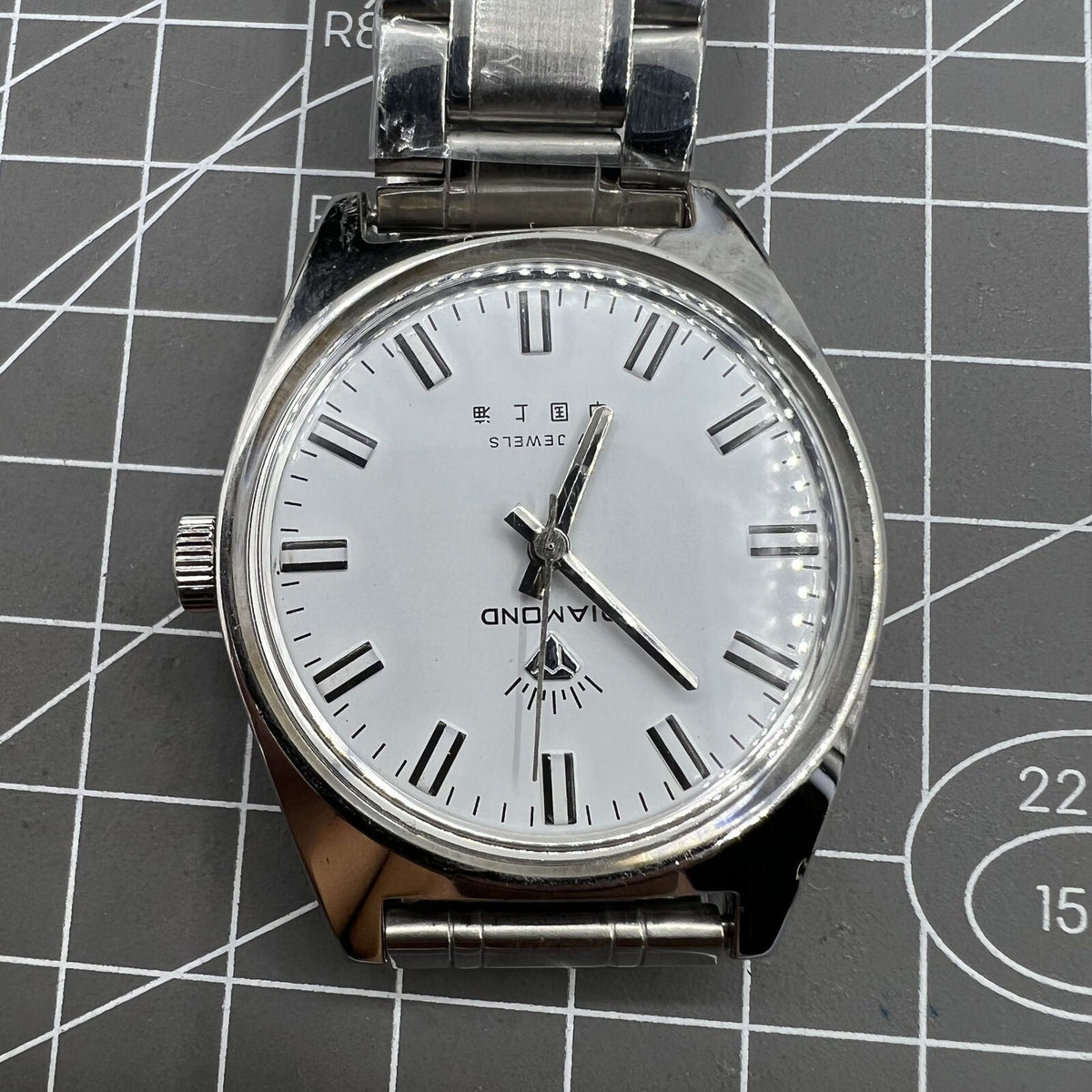 Shanghai Diamond 38mm manual mechanical watch with 17 jewels, white dial, silver case, elegant design.
