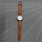 PUBU 32mm manual mechanical watch with grey dial and nail markers, 17 jewels, precision craftsmanship.