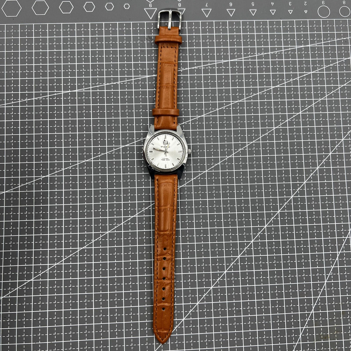 PUBU 32mm manual mechanical watch with grey dial and nail markers, 17 jewels, precision craftsmanship.