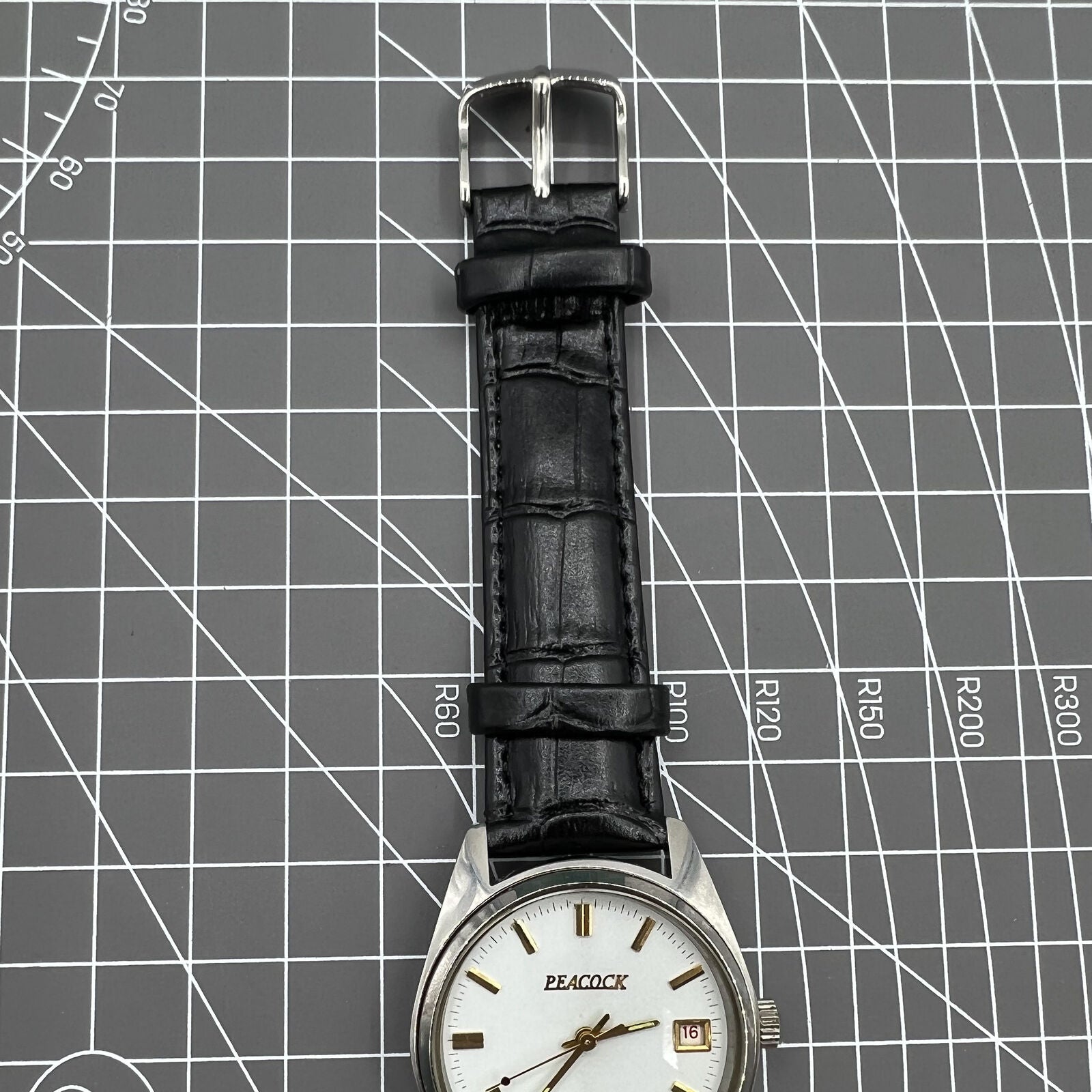 Liaoning Factory Made Peacock mechanical watch showcasing 17 jewels and shock-resistant design for durability.