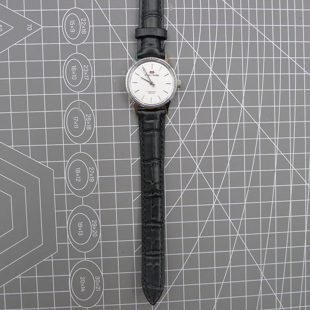 Beijing 31mm manual mechanical watch with silver case and double rhomb dial, showcasing classic Chinese craftsmanship.
