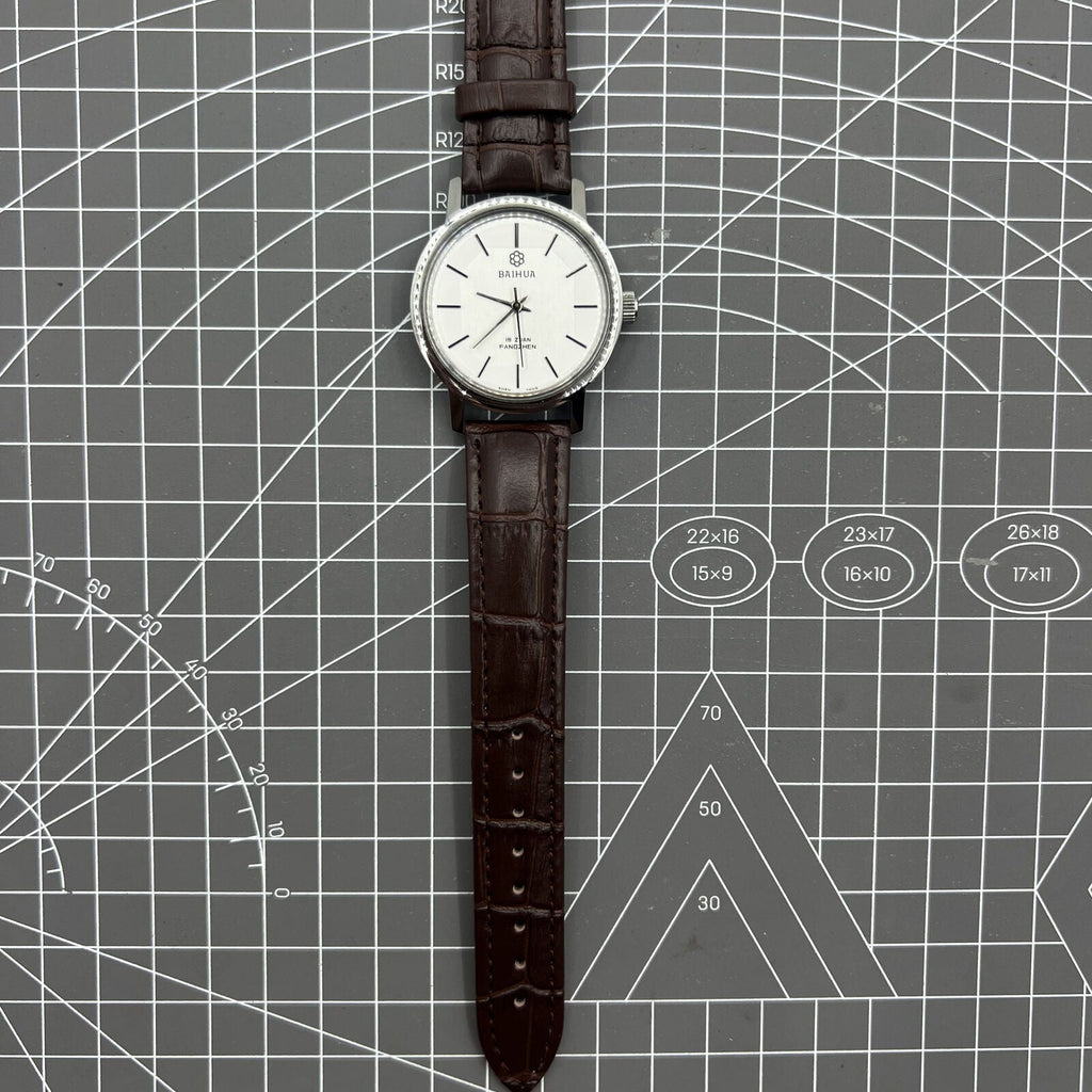 China Baihua 37mm manual mechanical watch with silver dial, 19 jewels, shock-resistant for durable everyday wear.