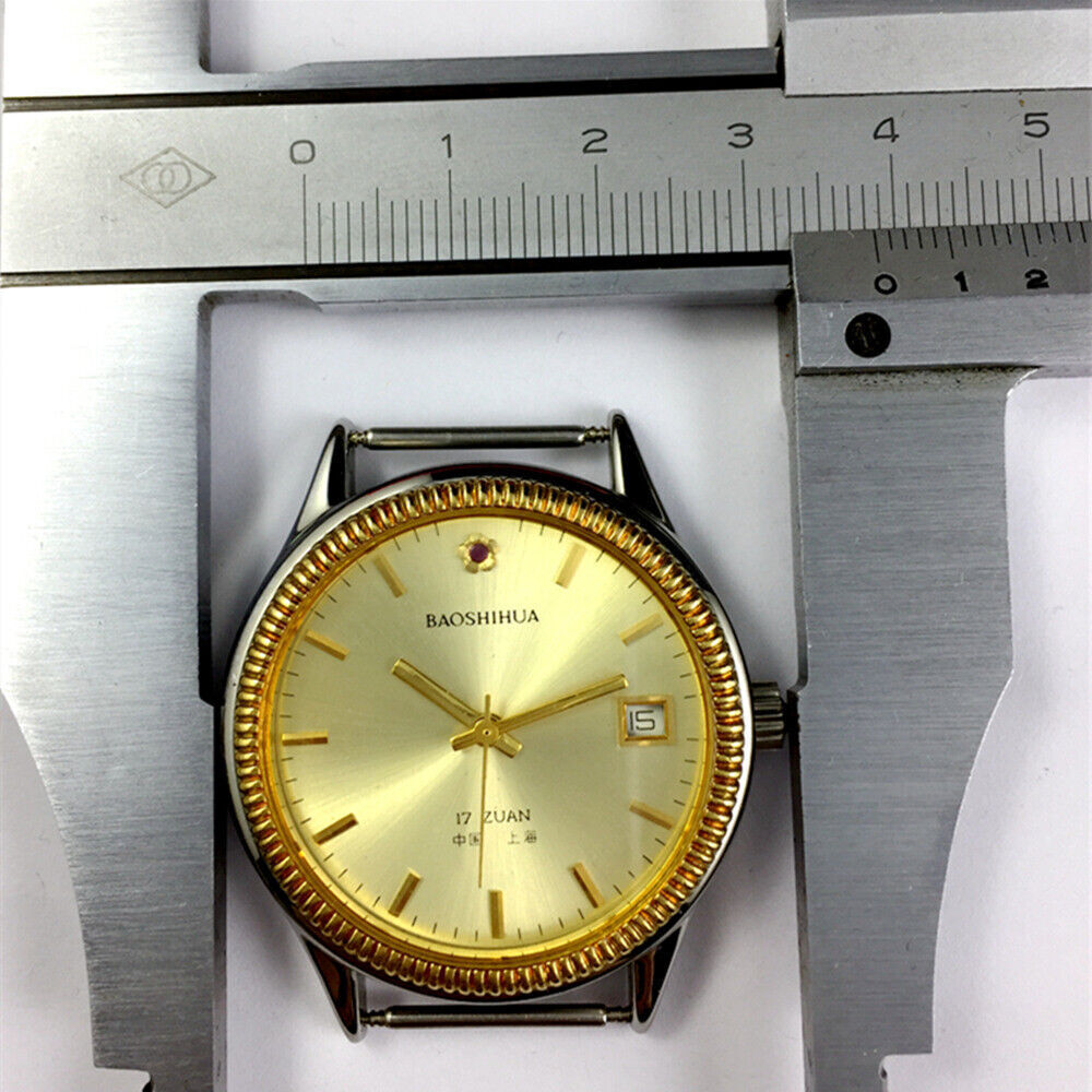 Shanghai 37mm manual watch with golden dial, nail markers, round case, 17 jewel mechanical movement by Shanghai.