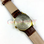 HONGLIAN manual mechanical watch with gold-tone case, golden hands, and nail markers for elegant style.