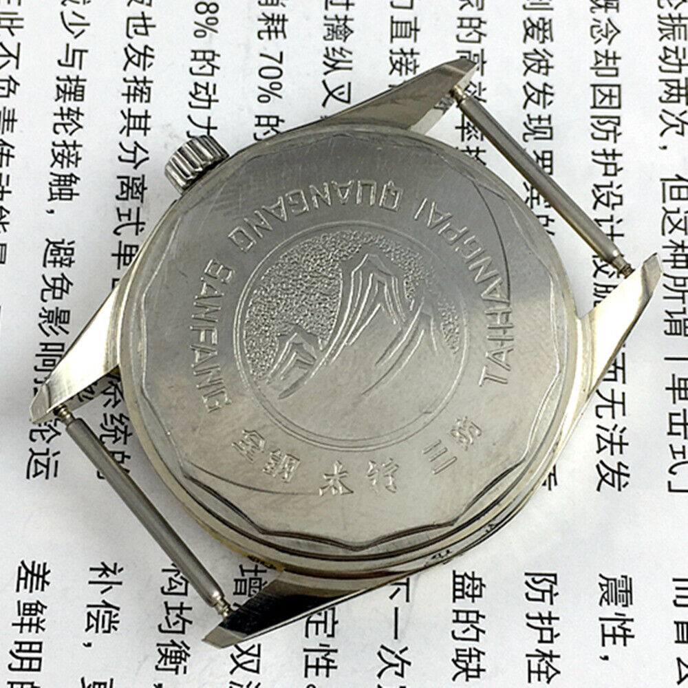 TAIHANG 38mm manual mechanical watch with silver dial, golden nail markers, and 17 jewel movement.