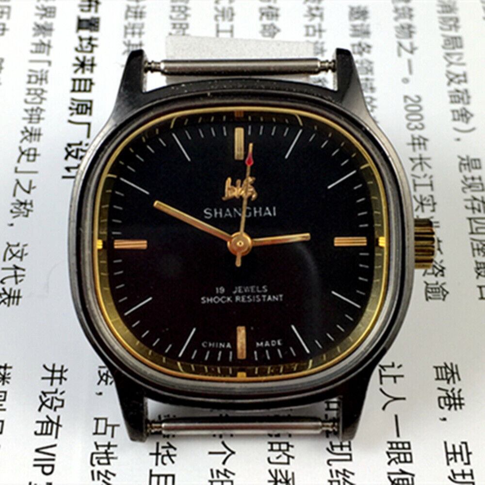 Shanghai Factory 34mm manual mechanical watch, black dial, 19 jewels, shock-resistant design.