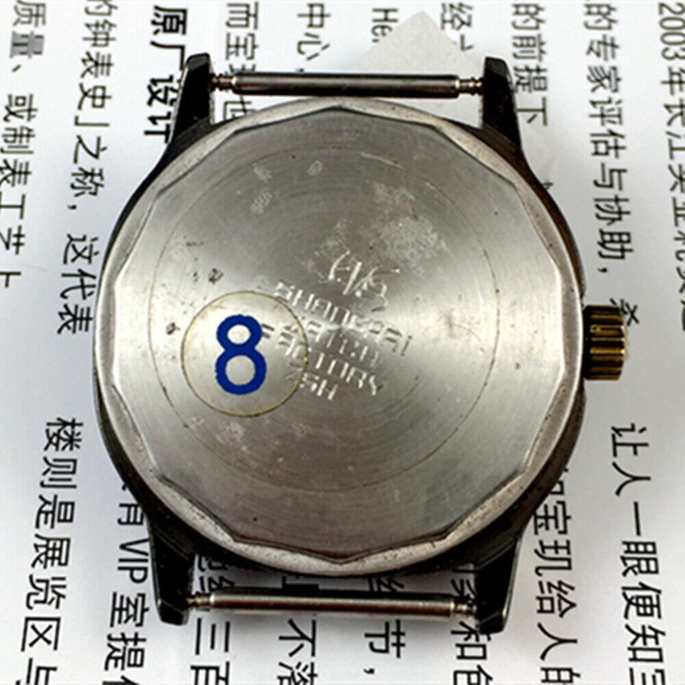 Shanghai Factory 34mm manual mechanical watch, black dial, 19 jewels, shock-resistant design.
