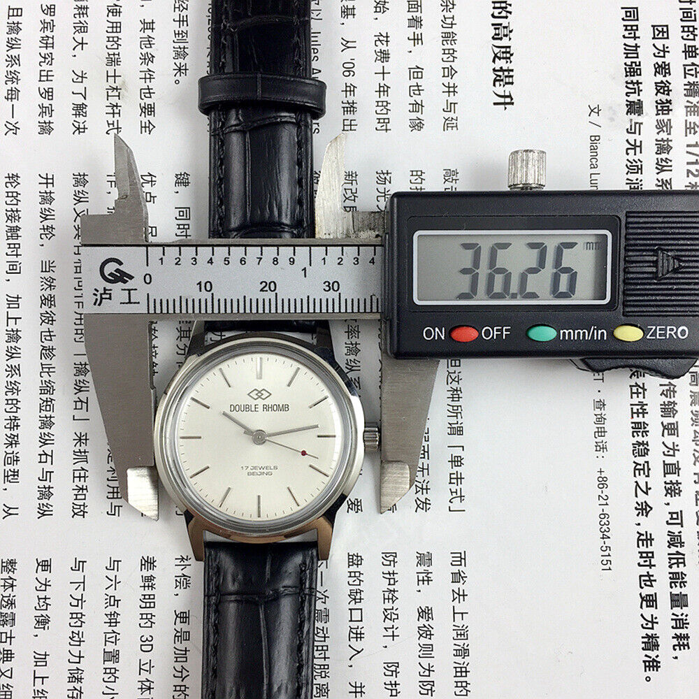 Beijing 36mm Double Rhomb watch with silver case and silver nail straps, manual mechanical movement, elegant design.