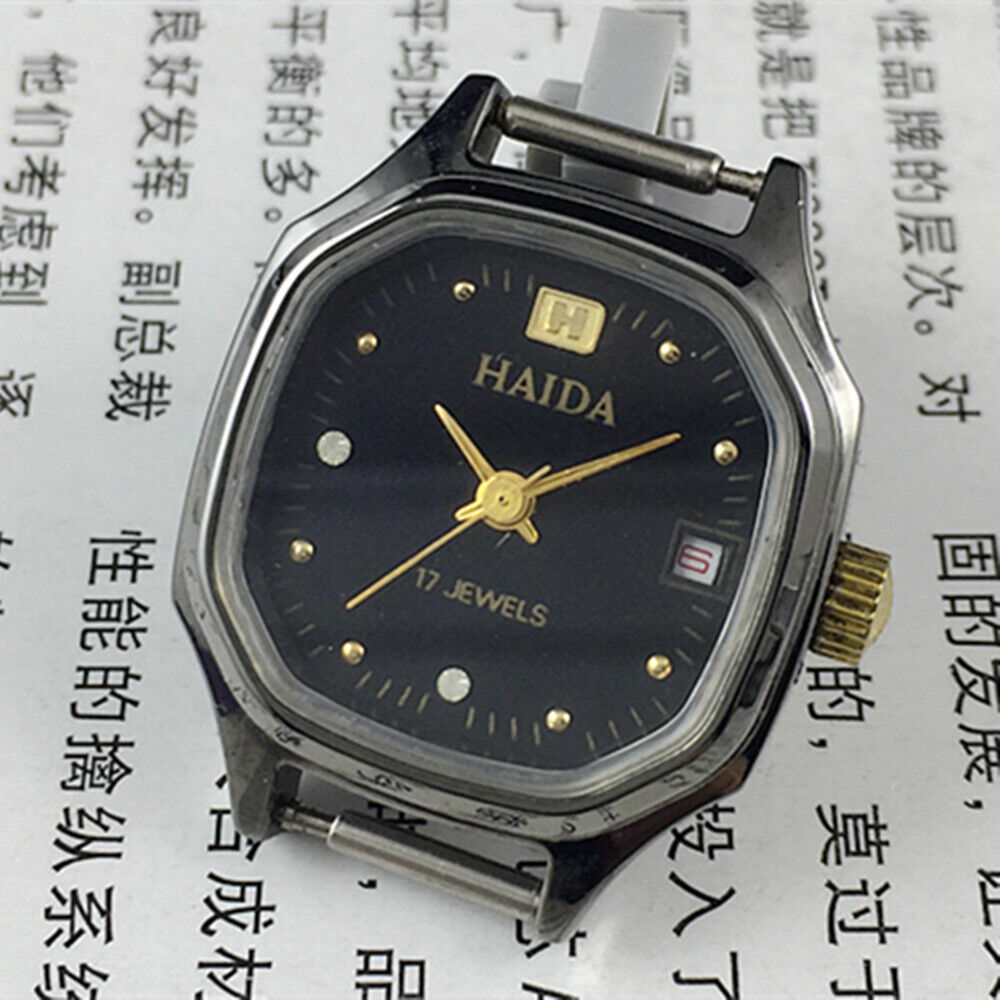 Manual mechanical lady watch with octagonal case, imitation diamonds, 17 jewels, elegant design for formal wear.