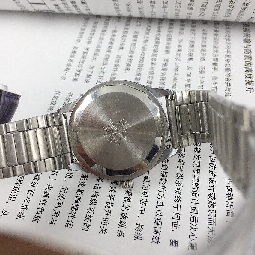 Shanghai Factory 36.5mm manual mechanical watch with 19 jewels, shock-resistant design for durability.