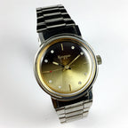 China Kongque Steel manual mechanical watch with 17 jewels, gradual golden brown dial, elegant design.