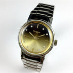China Kongque Steel manual watch featuring 17 jewels and a gradual golden brown dial with elegant design.