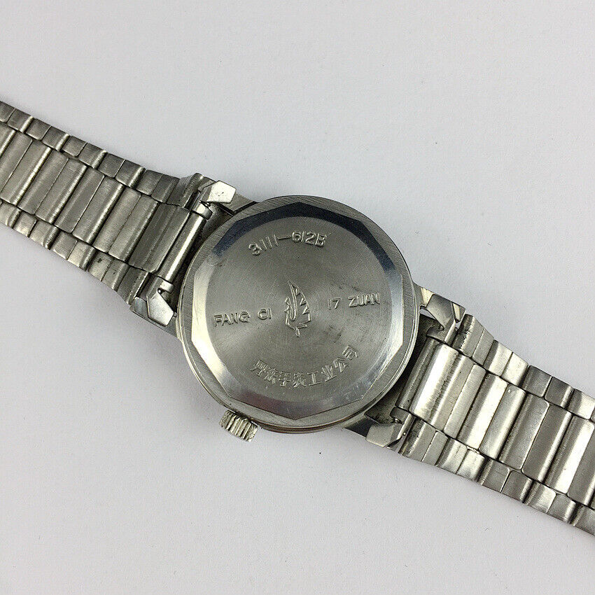 China Kongque Steel manual watch with 17 jewels, golden brown dial, classic elegant design for daily wear.