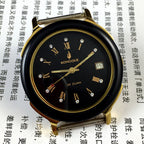37mm automatic mechanical watch with 33 jewels, black dial and golden Roman numerals.