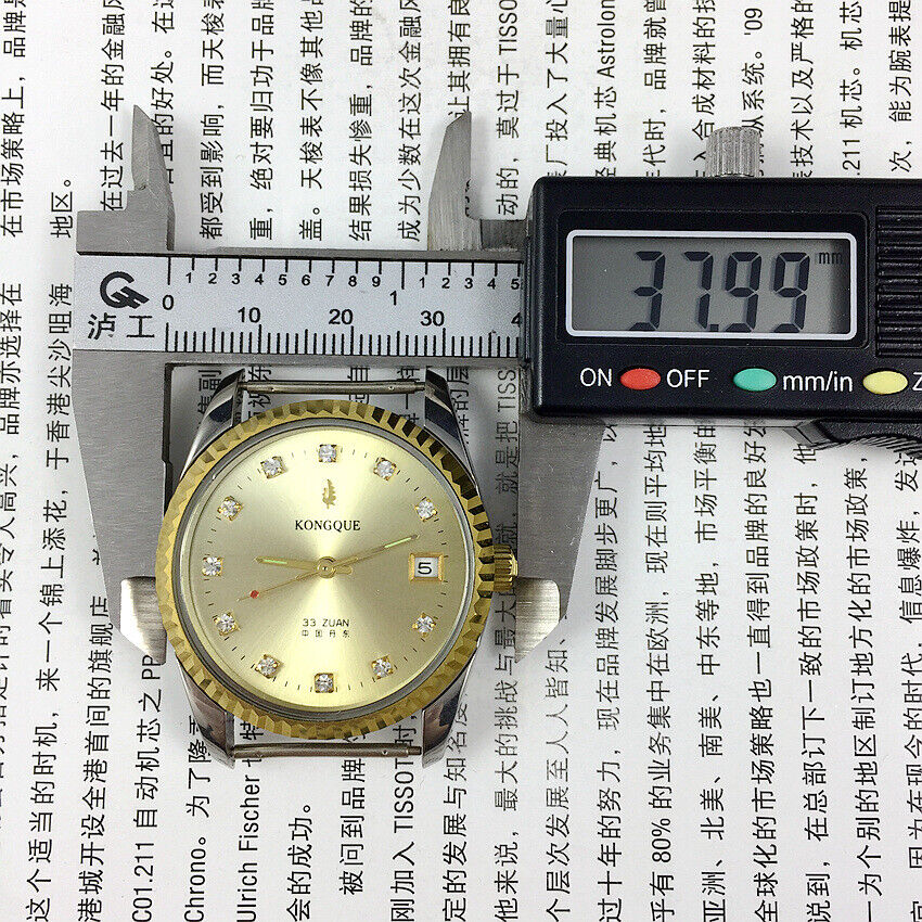 Dandong 37mm Peacock manual watch with golden dial, 33 jewels, and single calendar feature.