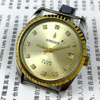 Dandong 37mm Peacock manual watch with golden dial, 33 jewels, and single calendar on wrist.
