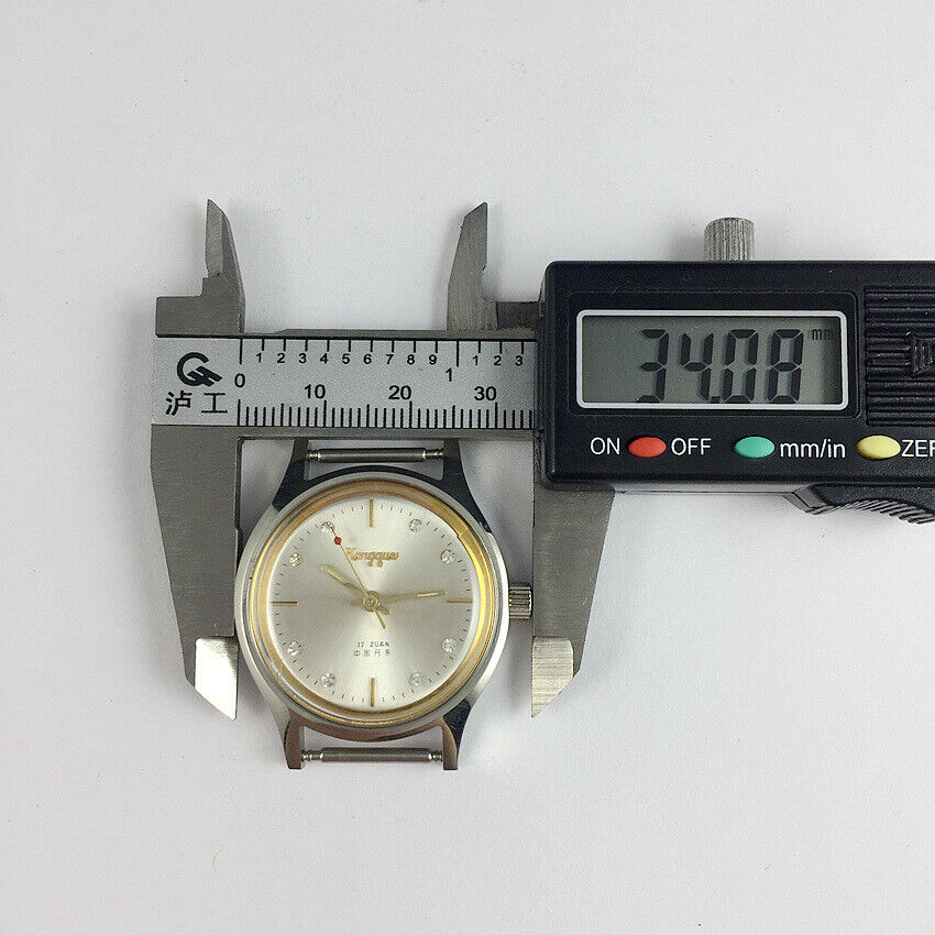 33mm Kongque steel manual watch with silver dial, 17 jewels, and matching band for elegant wear.