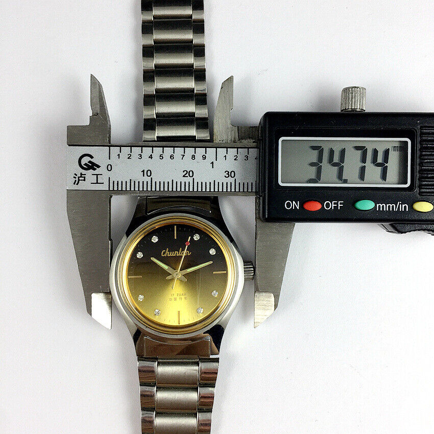 China Chunlan Steel mechanical watch featuring 17 jewels and a golden brown dial with classic elegance.