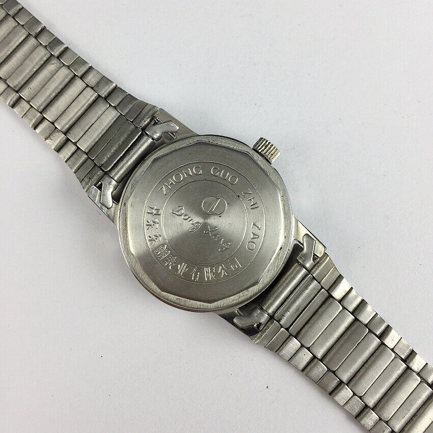 China Donglang Steel automatic watch with golden dial, 17 jewels, and steel band for elegant wear