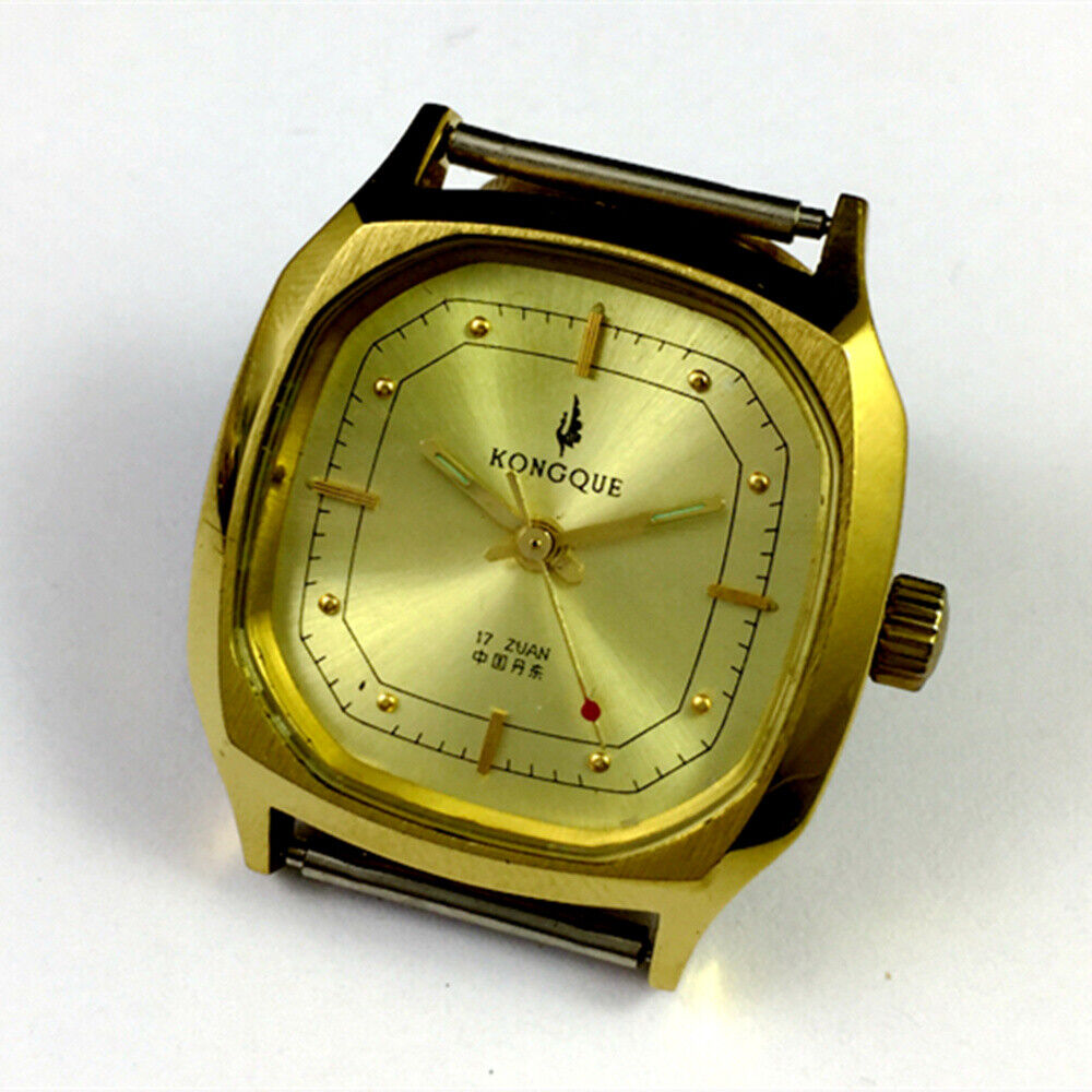 China Kongque 34mm manual steel watch with 17 jewels and golden dial featuring nail markers for elegant style.