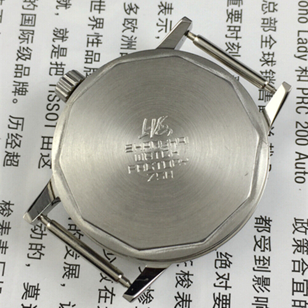 Silver 32mm Shanghai Factory manual watch with silver case, nail markers, and classic mechanical design