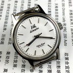 Silver 32mm Shanghai Factory manual mechanical watch with silver case, nail markers, and classic style for elegant wear.