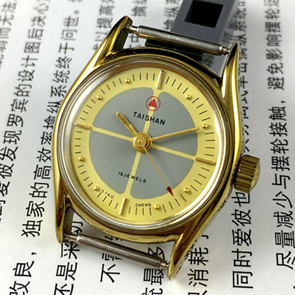 TAISHAN manual mechanical lady watch with 19 jewels, yellow-grey dial, and round gold case for elegant fashion.
