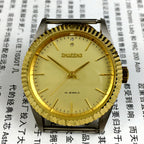 Round golden dial manual mechanical watch by Tianjin Factory showcasing classic Chinese craftsmanship and elegant design.