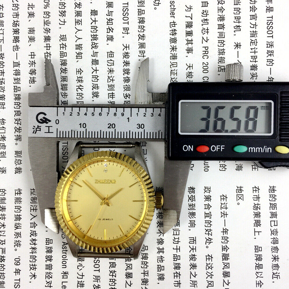 Round golden dial manual mechanical watch by Tianjin Factory, showcasing classic Chinese craftsmanship and timeless design.