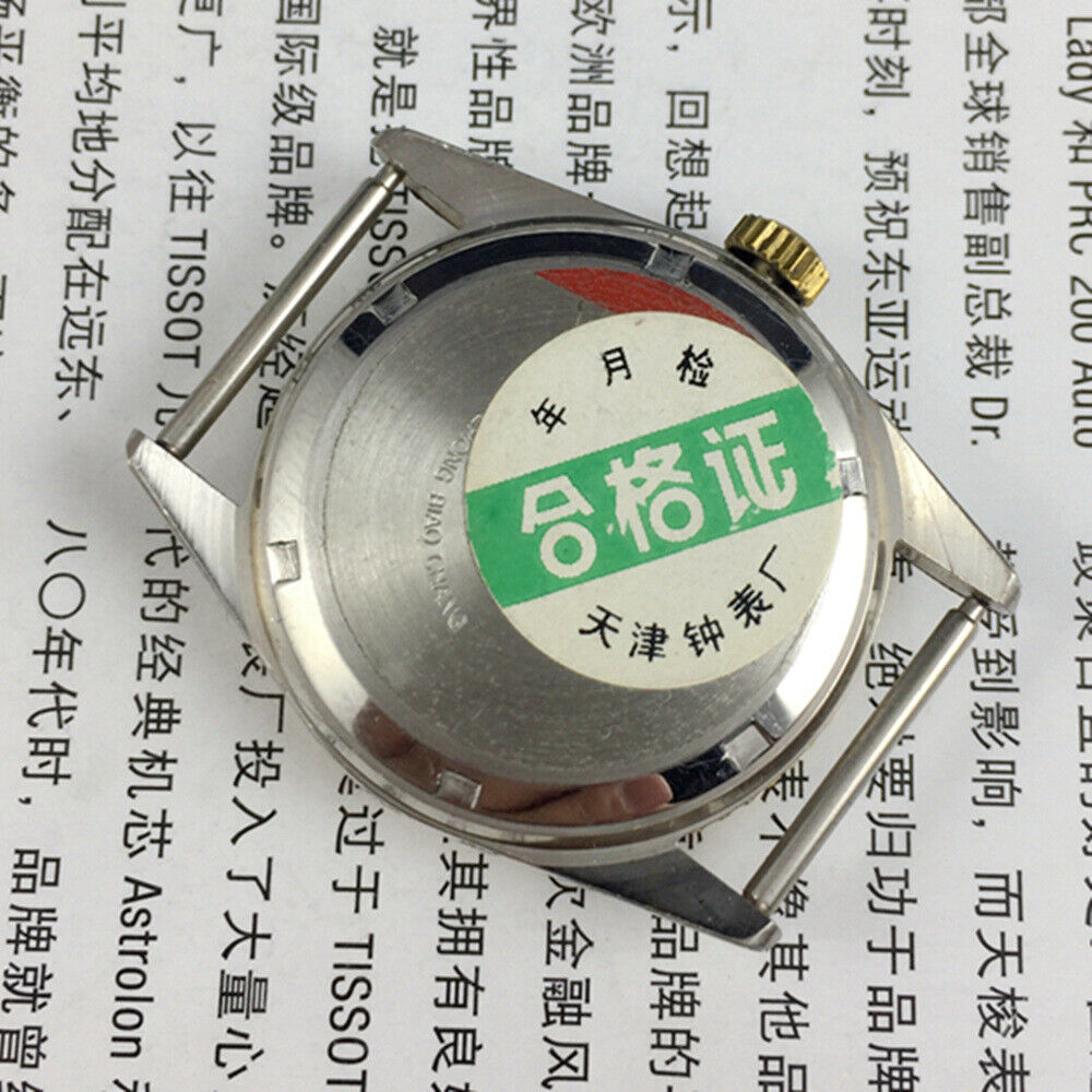 Round golden dial manual mechanical watch by Tianjin Factory showcasing classic Chinese craftsmanship.