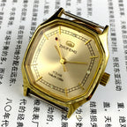 Octagonal golden dial mechanical watch by Tianjin Factory, classic design for elegant style and precision.