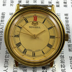 35mm Tianjin Seagull watch with golden round case and dial, manual mechanical movement, elegant design
