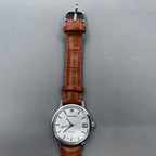 Light brown Shanghai manual mechanical watch with single calendar, 17 jewels, shock-resistant design for durability.