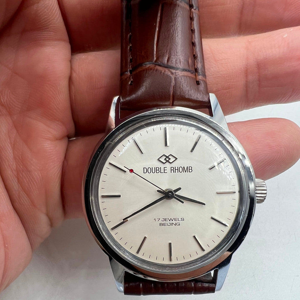 Beijing 36mm Double Rhomb silver watch with manual mechanical movement and silver nail markers, stylish accessory.