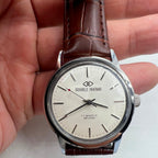 Beijing 36mm Double Rhomb silver watch with manual mechanical movement and silver nail markers, stylish accessory.