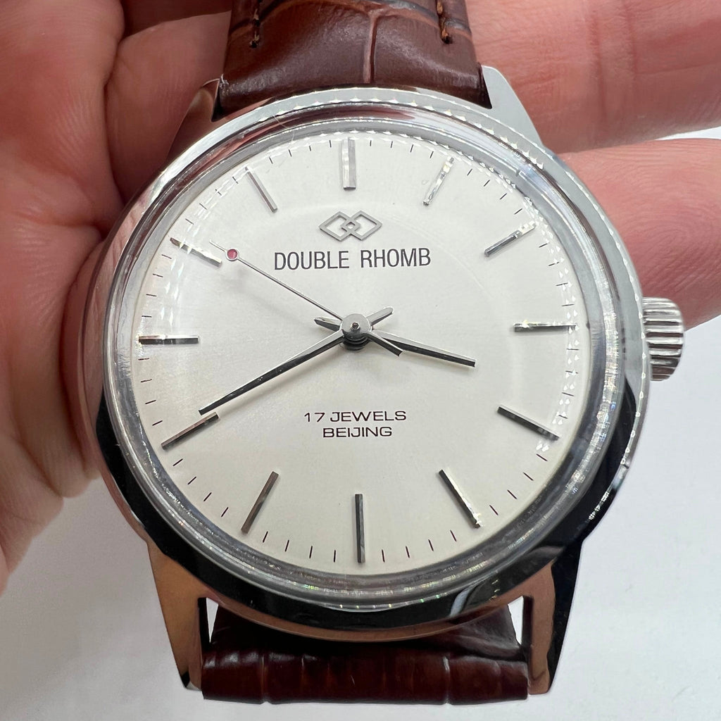 Beijing Double Rhomb 36mm manual watch with silver case and hour markers, classic mechanical timepiece.