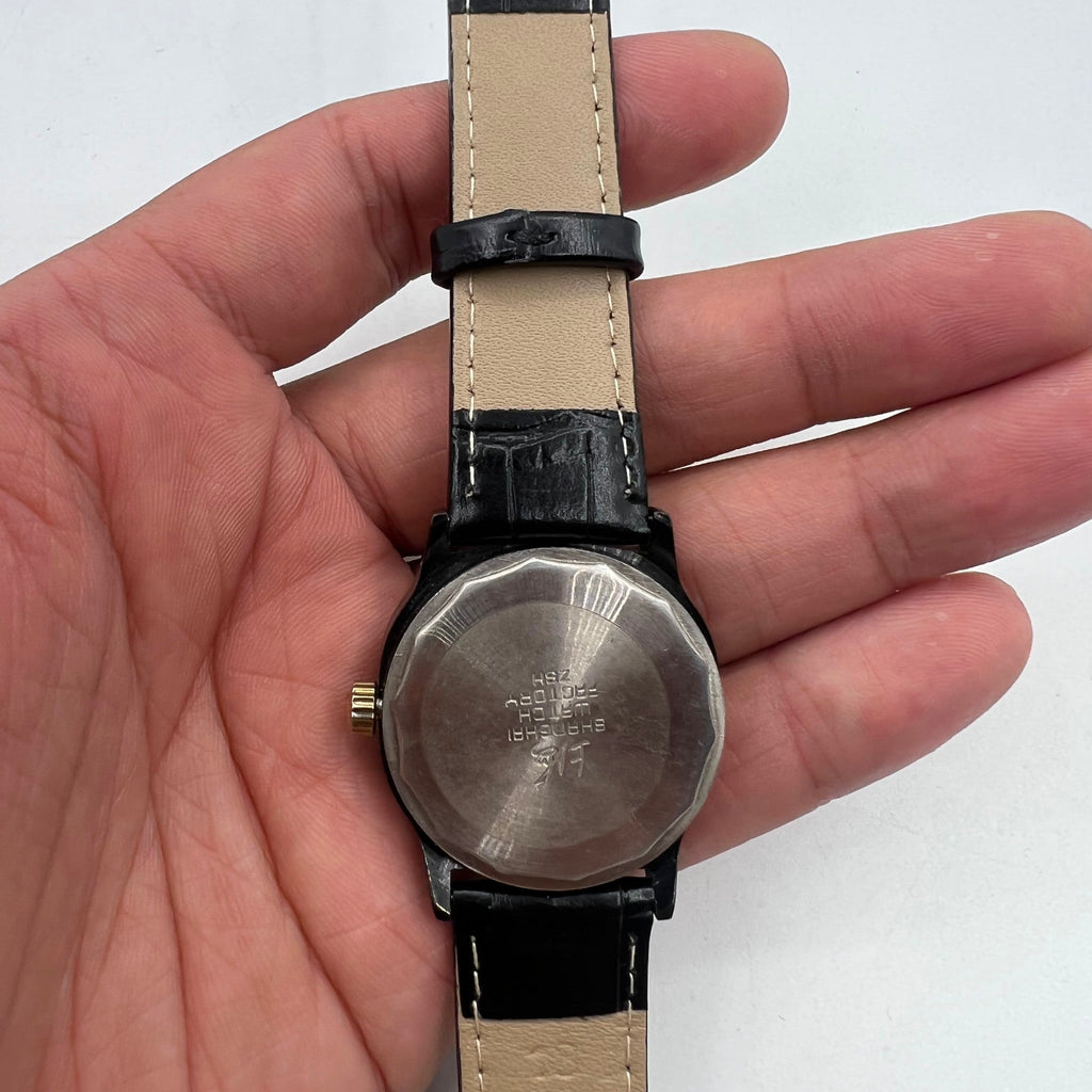 34mm Shanghai Factory manual watch with black dial, 19 jewels, shock-resistant for durability and precision.