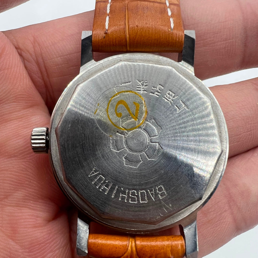 Shanghai 33mm manual mechanical watch with single calendar, 17 jewels, shock-resistant design for everyday wear.