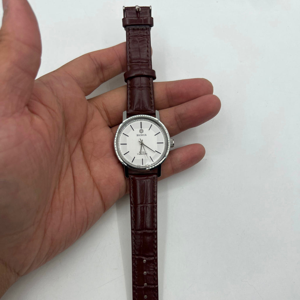 37mm China Baihua manual mechanical watch with silver dial, 19 jewels, shock-resistant design.