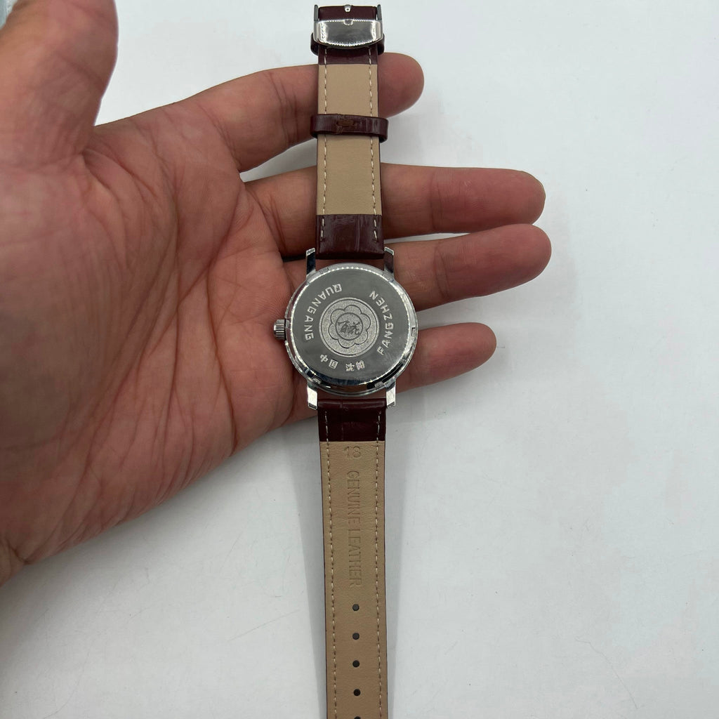 China Baihua 37mm manual mechanical watch with silver dial, 19 jewels, and shock-resistant build.