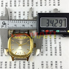Shanghai Manual Mechanical Watch with golden markers, light brown dial, and refined octagonal gold-tone case design.