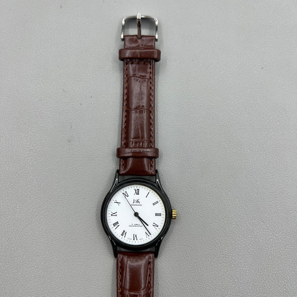 Shanghai 37mm manual mechanical watch with brown leather strap, Roman numerals, 17 jewels, classic style.
