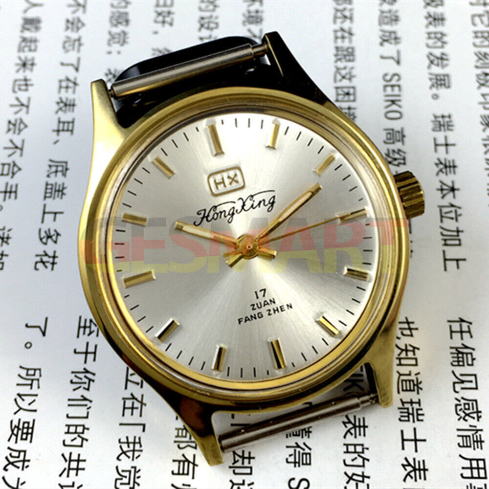 33mm China-made manual mechanical watch with golden hour markers and silver dial, shock-resistant design.