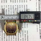 Shanghai Manual Mechanical Watch featuring golden nail hour markers, square case, and gradient brown dial for a refined look.