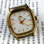 HONGLIAN manual mechanical watch with golden nail accents, square golden case, and white dial for elegant style.