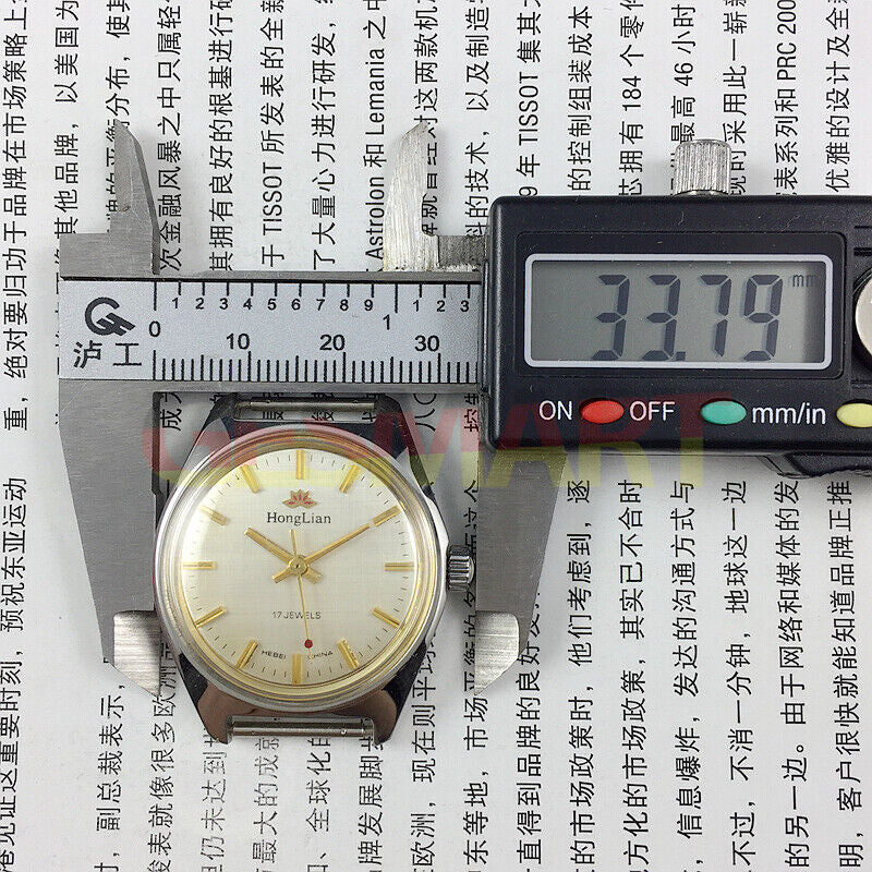 HONGLIAN 32mm manual mechanical watch with 17 jewels, golden nail markers, and sleek grey dial for classic style.