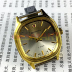 32mm Shanghai manual mechanical watch with golden nails and brown dial in octagonal case.