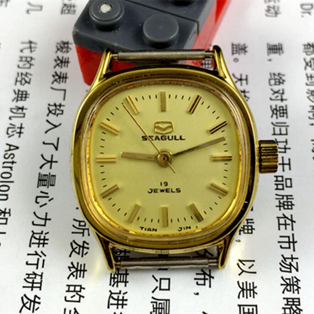 Golden dial ladies watch with 19 jewels, manual mechanical movement by Seagull, Tianjin China brand.