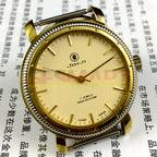 37mm Shanghai Jinji manual watch with 17 jewels, shock-resistant, gold-tone nail accents, classic style.